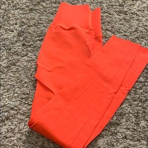 Bright orange Fabletics 7/8 pants
